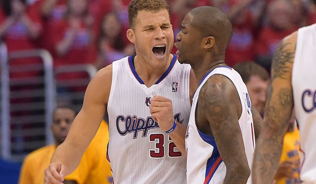 Los Angeles Clippers forward Blake Griffin celebrates with guard Jamal Crawford during the second half in Game 7 of an opening-round NBA basketball playoff series against the Golden State Warriors, Saturday, May 3, 2014, in Los Angeles. The Clippers won 126-121. (AP Photo/Mark J. Terrill)