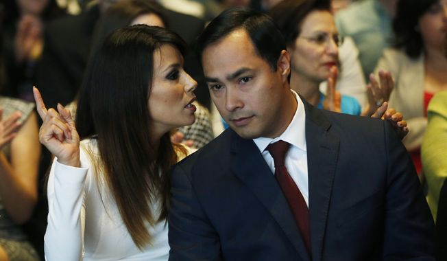 Actress Eva Longoria speaks with Rep. Joaquin Castro, D-Texas, at an event launching The Latino Victory Project, a Latino political action committee, at the National Press Club in Washington, Monday, May 5, 2014. (AP Photo/Charles Dharapak)