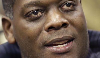 FILE - In this Jan. 9, 2014, file photo, Dallas District Attorney Craig Watkins answers a question during an interview in his office in Dallas. State District Judge Jeanine Howard removed herself from a rape case after telling a newspaper she thought the 14-year-old victim "wasn't the victim she claimed to be." Watkins said his prosecutors had pushed for five years' prison time. He also said the judge declined to require Young to follow standard sex offender requirements such as attending treatment, undergoing an evaluation or staying away from children. (AP Photo/LM Otero, File)