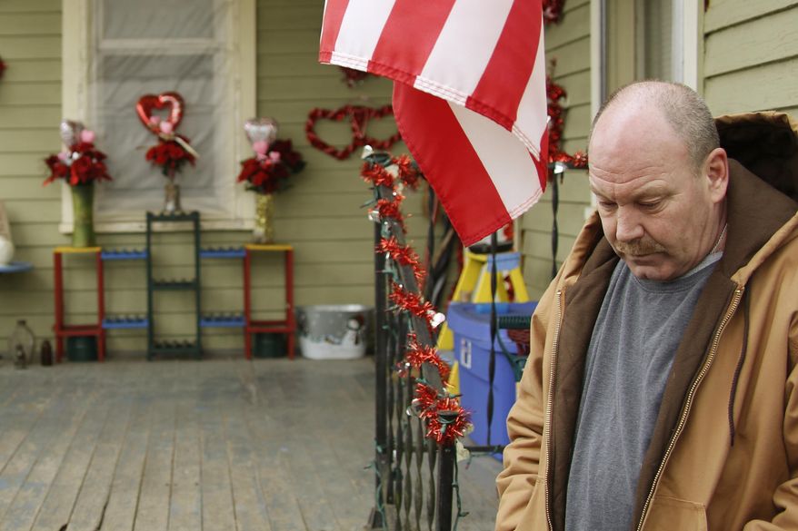 In this Saturday, March 1, 2014 photo, William Saum stands near his front porch in Clarksburg, W. Va. In March 2013, a truck carrying drilling water overturned onto a car carrying his wife and two young sons. Both children, 7-year-old Nicholas Mazzei-Saum and 8-year-old Alexander, were killed. An analysis of traffic fatalities in the busiest new oil and gas-producing counties in the U.S. shows a sharp rise in deaths that experts say is related to the drilling boom. (AP Photo/Keith Srakocic)