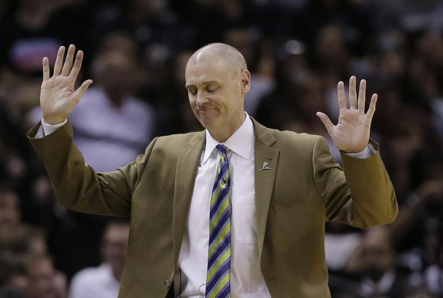 Dallas Mavericks coach Rick Carlisle throws his hands up in response to a called foul during the second half of Game 7 of the opening-round NBA basketball playoff series against the San Antonio Spurs, Sunday, May 4, 2014, in San Antonio. San Antonio won 119-96. (AP Photo/Eric Gay)