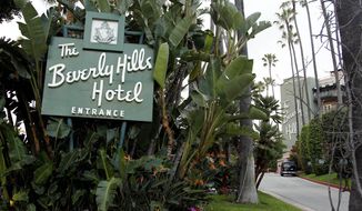 FILE - In this April 25, 2012 file photo, the entrance to the Beverly Hills Hotel is seen in Beverly Hills, Calif.  Hollywood is responding to harsh new laws in Brunei by boycotting the Beverly Hills Hotel. The Motion Picture &amp;amp; Television Fund joined a growing list of organizations and individuals Monday, May 5, 2014, refusing to do business with hotels owned by the Sultan or government of Brunei to protest the country’s new penal code that calls for punishing adultery, abortions and same-sex relationships with flogging and stoning.  (AP Photo/Matt Sayles, File)