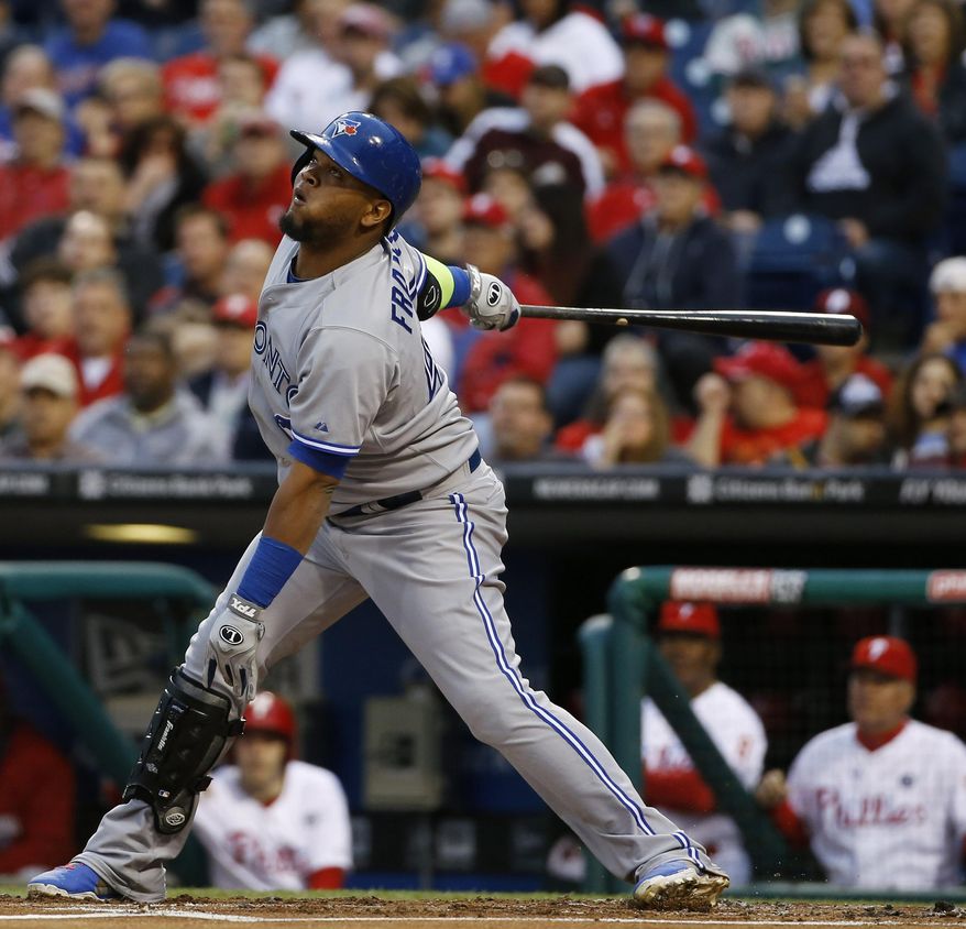 Toronto Blue Jays' Juan Francisco follows through after hitting a run-scoring single during the first inning of an interleague baseball game against the Philadelphia Phillies, Monday, May 5, 2014, in Philadelphia. (AP Photo/Matt Slocum)