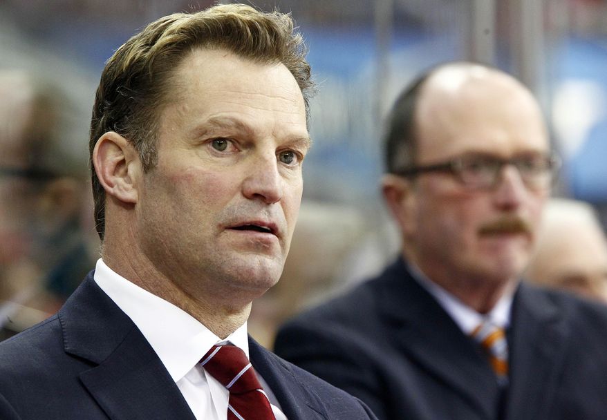 FILE - In this March 5, 2013 file photo, Carolina Hurricanes head coach Kirk Muller watches the action against the Buffalo Sabres during the first period of an NHL hockey game in Raleigh, N.C. The Hurricanes have fired Muller. The team announced his dismissal Monday, May 5, 2014. (AP Photo/Karl B DeBlaker, File)