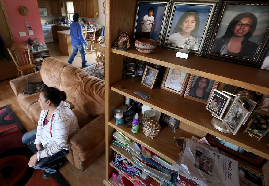 Ho-Chunk Nation member Kim Ramirez, pictured in her rural Black River Falls, Wis. home, Friday, April 11, 2014, hopes the monetary payouts her three children will receive from the tribe after graduating high school will be better spent than the allocation she received when she was younger. (AP Photo/Wisconsin State Journal, John Hart)