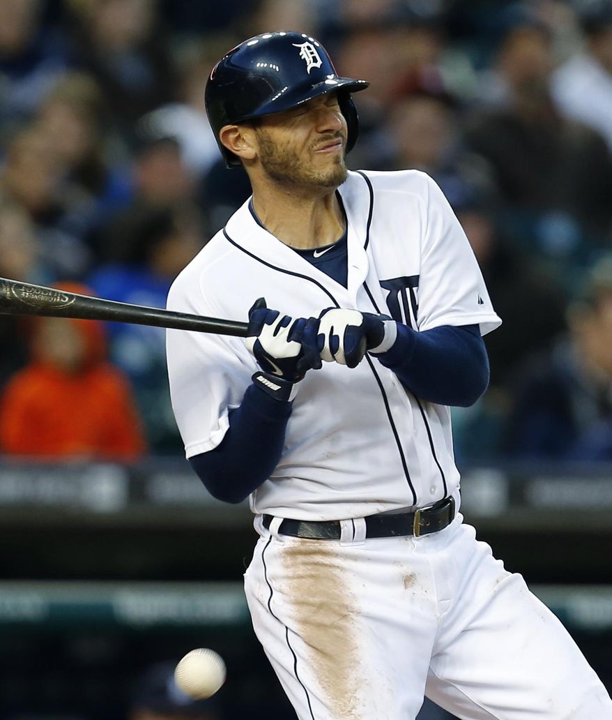 Detroit Tigers' Ian Kinsler reacts to being hit by a Houston Astros pitcher Jarred Cosart pitch in the fifth inning of a baseball game in Detroit Monday, May 5, 2014. (AP Photo/Paul Sancya)