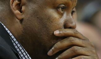 FILE - In this Feb. 16, 2014 file photo, Oregon State coach Craig Robinson watches during a game against Oregon, in Eugene, Ore. Oregon State fired Robinson, Monday, May 5, 2014,  after six seasons without making the NCAA tournament. (AP Photo/Chris Pietsch, File)