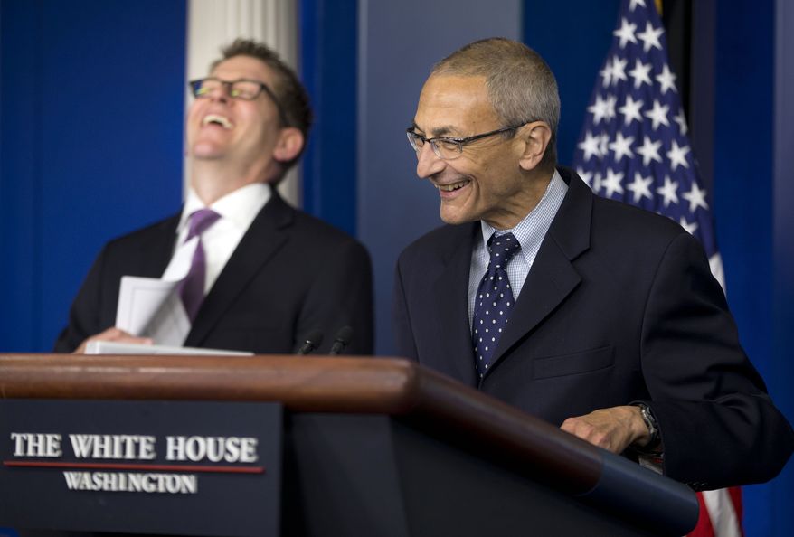 White House press secretary Jay Carney, left, and White House senior counselor John Podesta, right, laugh during the daily news briefing at the White House in Washington Monday, May 5, 2014. Podesta, who served as Chief of Staff under President Clinton, was answering a question about his returning to work for the White House. (AP Photo/Pablo Martinez Monsivais)