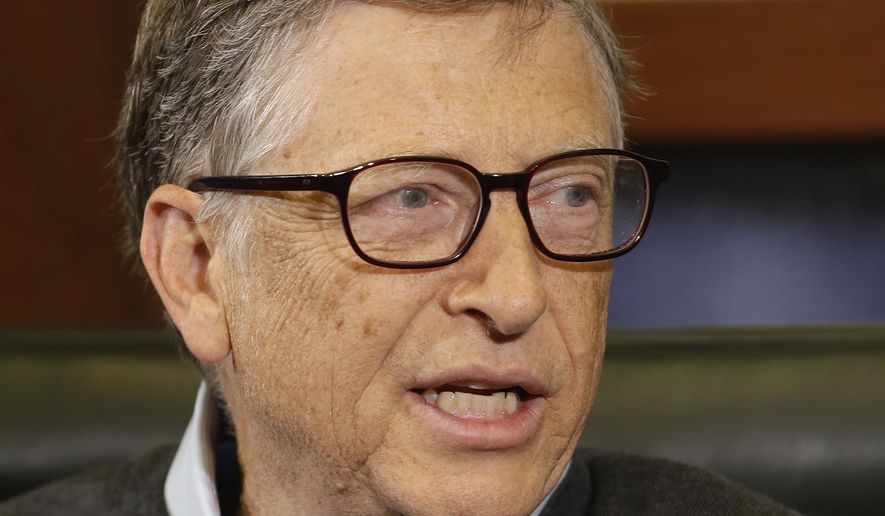 Microsoft co-founder and Berkshire Hathaway board member Bill Gates gestures during an interview with Liz Claman on the Fox Business Network in Omaha, Neb., Monday, May 5, 2014. The annual Berkshire Hathaway shareholders meeting concluded over the weekend. (AP Photo/Nati Harnik)
