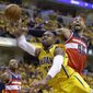Washington Wizards forward Drew Gooden (90) fouls Indiana Pacers guard C.J. Watson as he shoots during the second half of game 1 of the Eastern Conference semifinal NBA basketball playoff series in Indianapolis, Monday, May 5, 2014. The wizards defeated the Pacers 102-96. (AP Photo/Michael Conroy)