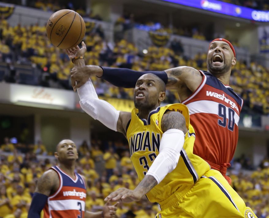 Washington Wizards forward Drew Gooden (90) fouls Indiana Pacers guard C.J. Watson as he shoots during the second half of game 1 of the Eastern Conference semifinal NBA basketball playoff series in Indianapolis, Monday, May 5, 2014. The wizards defeated the Pacers 102-96. (AP Photo/Michael Conroy)