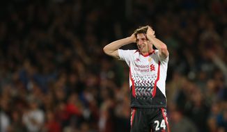 Liverpool&#x27;s Joe Allen reacts at the end of the English Premier League soccer match between Crystal Palace and Liverpool at Selhurst Park stadium in London, Monday, May 5, 2014.The game ended in a 3-3 draw. (AP Photo/Alastair Grant)