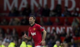 Manchester United&#39;s interim manager Ryan Giggs takes to the pitch as a substitute during his team&#39;s English Premier League soccer match against Hull at Old Trafford Stadium, Manchester, England, Tuesday May 6, 2014. (AP Photo / Jon Super)