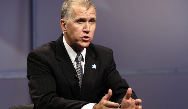 FILE - In this April 23, 2014, file photo, Republican senatorial candidate Thom Tillis responds during a televised debate at WRAL television studios in Raleigh, N.C.  The struggle for control of the Republican Party is getting an early voter test in North Carolina, where former presidential nominee Mitt Romney and tea party favorite Rand Paul on Monday, May 5 pushed their own candidates for the right to challenge Democratic Sen. Kay Hagan in November.(AP Photo/Gerry Broome, Pool)