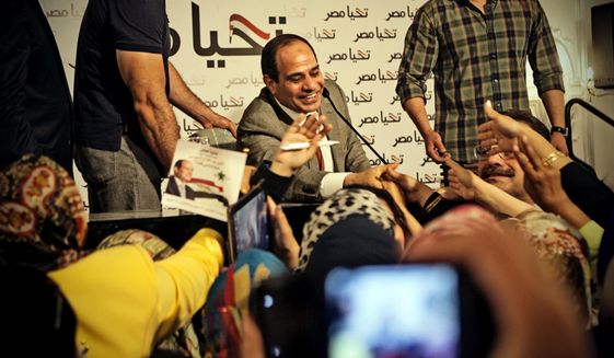 This Monday, May 5, 2014 photo released by the presidential campaign of Abdel-Fattah el-Sissi shows the candidate greeting supporters at a gathering of some 600 women in Cairo, Egypt. El-Sissi acknowledged the importance of Egyptian women in shaping the nation&#39;s history and building the nation’s future according to campaign officials. (AP Photo/El-Sissi for President) **FILE**