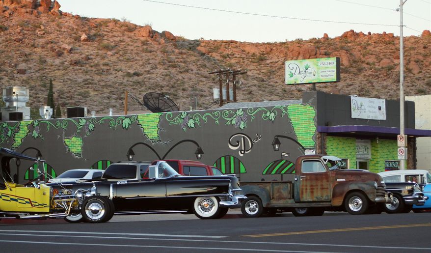 This Sept. 17, 2011 photo provided by Jim Hinckley shows a display of classic cars on Beale Street in Kingman, Ariz. The city is preparing to host an international Route 66 festival in August 2014 featuring classic cars, drive-in movies and concerts. (AP Photo/Courtesy of Jim Hinckley)