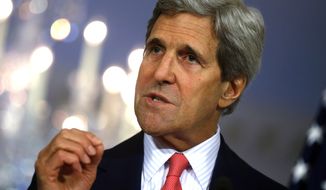 Secretary of State John Kerry speaks to reporters at the State Department in Washington, Tuesday, May 6, 2014. Kerry announced sanctions on individuals involved in the conflict in South Sudan and spoke about Ukraine, Nigeria, Iran, and Syria. (AP Photo/Charles Dharapak)