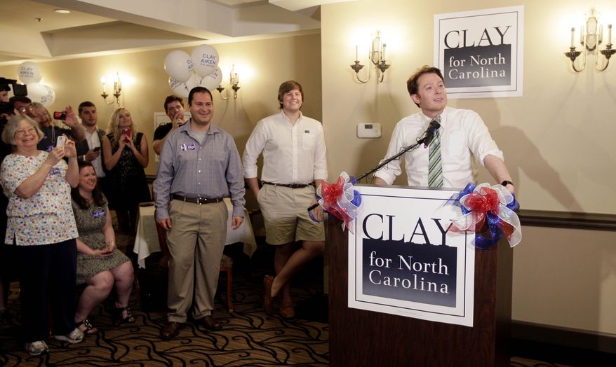 Clay Aiken, right, speaks to supporters during an election night watch party in Holly Springs, N.C., Tuesday, May 6, 2014. Aiken is seeking the Democratic nomination for North Carolina's 2nd Congressional District. (AP Photo/Gerry Broome)