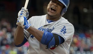 Los Angeles Dodgers Juan Uribe reacts after striking out in the ninth inning of a baseball game against the Washington Nationals Wednesday, May 7, 2014 in Washington. Nationals won 3-2. (AP Photo/Pablo Martinez Monsivais)