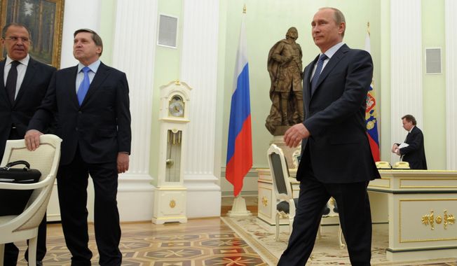 Russian President Vladimir Putin, right, heads to meet with Swiss Federal President Didier Burkhalter in the Kremlin in Moscow, Wednesday, May 7, 2014.  From left, Russian Foreign Minister Sergey Lavrov and President&#x27;s aide Yury Ushakov. (AP Photo/RIA-Novosti, Alexei Druzhinin, Presidential Press Service)