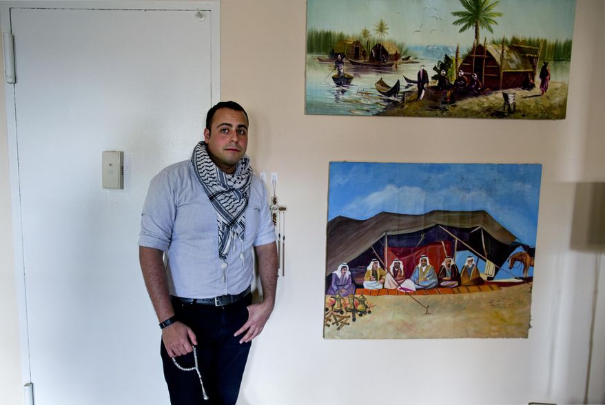 In this Sunday, May 4, 2014 photo, Bashar Makhay stands for a photo in his apartment in the Brooklyn borough of New York. Makhay, who is Iraqi-American, Catholic and gay, said he created Tarab, a series of parties, beach gatherings and other events for LGBT Arabs and Middle Easterners in New York City. The Tarab program will celebrate its second anniversary with an event May 10. (AP Photo/Craig Ruttle)