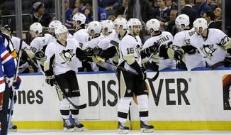Pittsburgh Penguins&#39; Brandon Sutter (16) celebrates a goal with teammates during the second period of a second-round NHL Stanley Cup hockey playoff series against the New York Rangers, Wednesday, May 7, 2014, in New York. (AP Photo/Frank Franklin II)