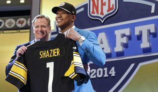 Ohio State outside linebacker Ryan Shazier poses with NFL commissioner Roger Goodell after being selected by the Pittsburgh Steelers as the 15th pick in the first round of the 2014 NFL Draft, Thursday, May 8, 2014, in New York. (AP Photo/Craig Ruttle)