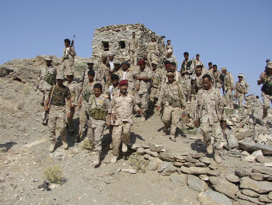 In this photo provided by the Yemen Ministry of Defense, Yemeni troops gather as they take positions at the frontline of fighting with al-Qaida militants in the southeastern province of Shabwa, Yemen, Tuesday, May 6, 2014. Yemeni troops seized two al-Qaida strongholds in the country&#39;s south after a days-long offensive that left dozens of suspected militants and troops dead, the country&#39;s Defense Ministry said Tuesday. (AP Photo/Yemen&#39;s Defense Ministry)