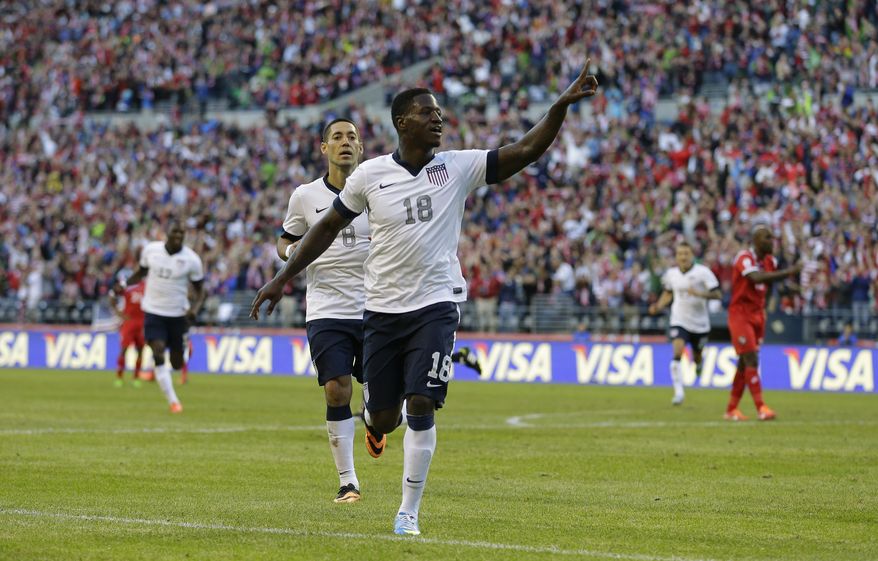 USA&#39;s Eddie Johnson, right, and Clint Dempsey, left, celebrate after Johnson scored a goal against Panama during World Cup qualifier soccer match, Tuesday, June 11, 2013, in Seattle. (AP Photo/Ted S. Warren)