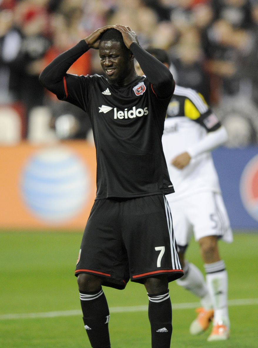 D.C. United forward Eddie Johnson (7) reacts during the second half of an MLS soccer game against the Columbus Crew, Saturday, March 8, 2014, in Washington. Columbus won 3-0. (AP Photo/Nick Wass)