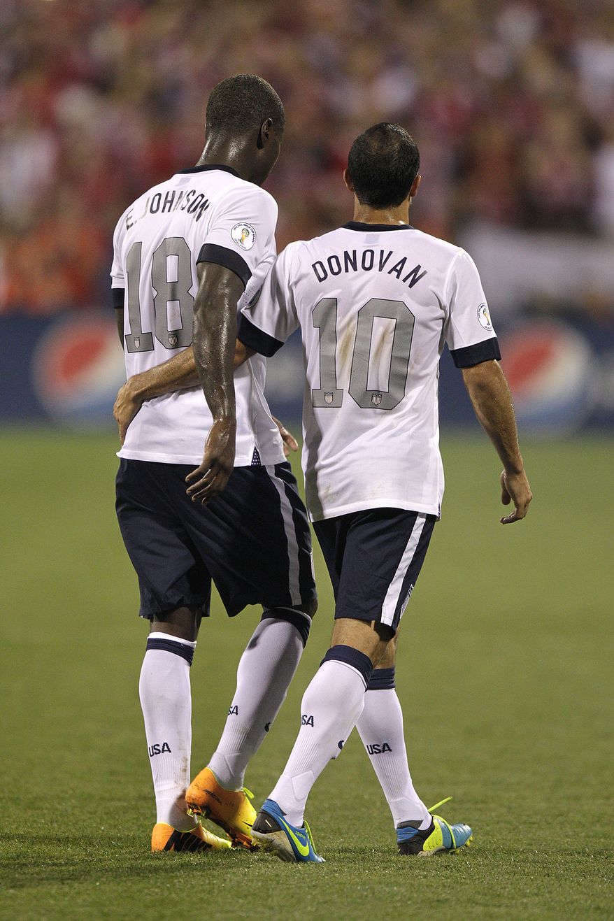 United States&#39; Eddie Johnson, left, and Landon Donovan walk off the field against Mexico in a World Cup qualifying soccer match Tuesday, Sept. 10, 2013, in Columbus, Ohio. (AP Photo/Jay LaPrete)