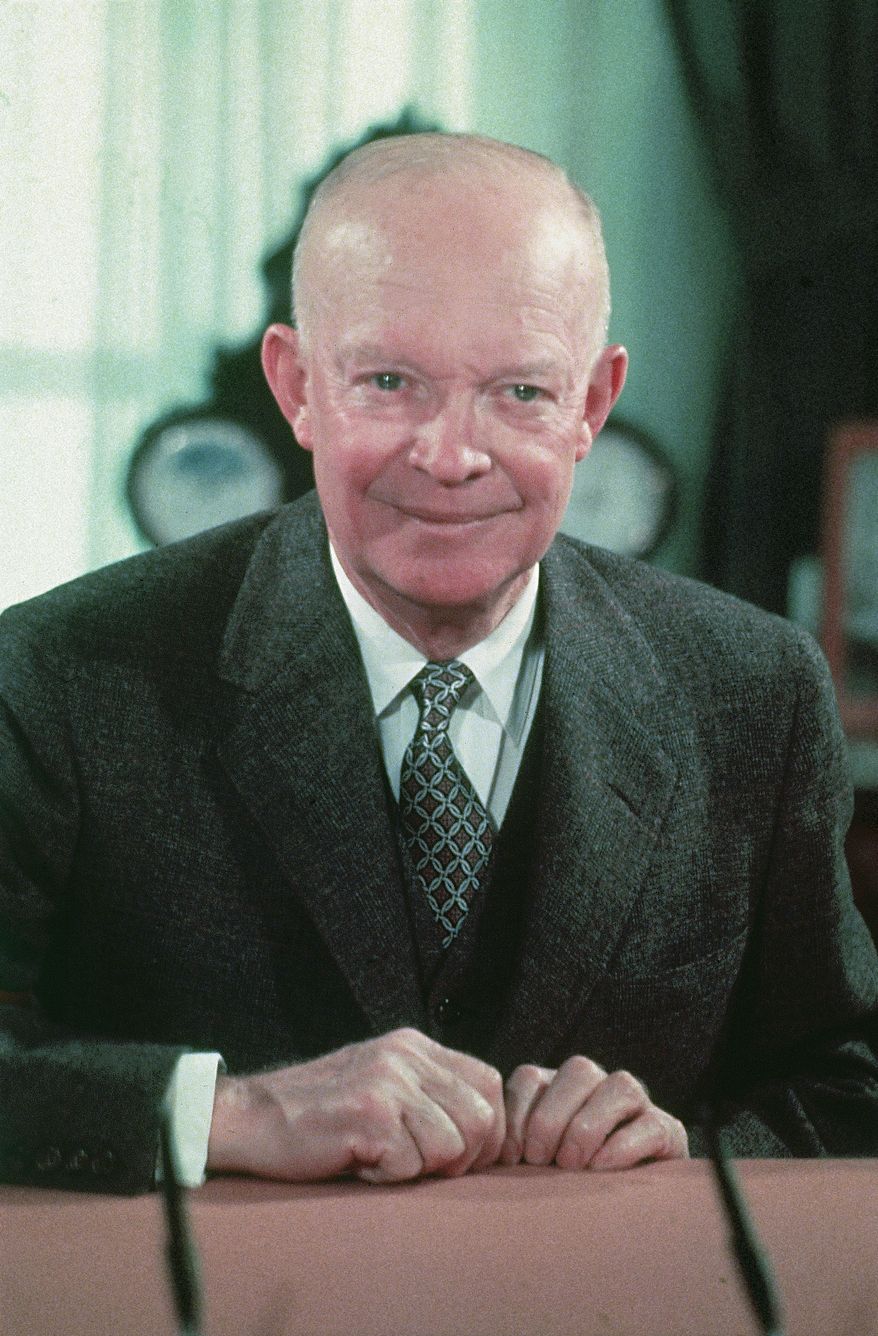 ** FILE ** In this 1956 file photograph, President Dwight Eisenhower is seen at his desk in the White House in Washington.  (AP Photo/File)