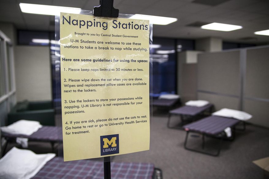 ADVANCE FOR MONDAY, MAY 12- In an April 29, 2014 photo, a napping station implemented at the Shapiro Undergraduate Library at the University of Michigan in Ann Arbor, Mich., is seen. For students looking to get a quick nap in between exam preparations but who live too far away to do so, the new napping station could be the best alternative. (AP Photo/The Michigan Daily, Allison Farrand)