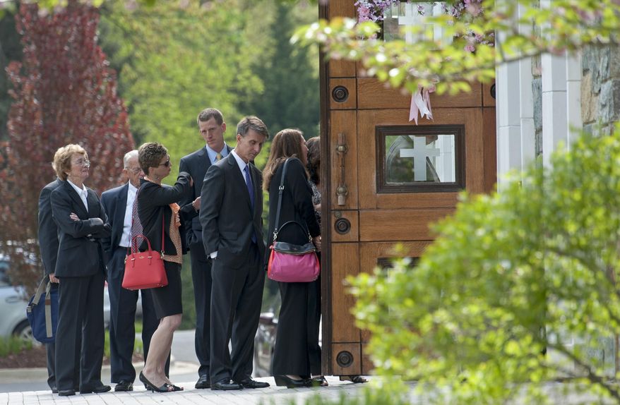 Mourners wait in line to enter Our Lady of Mercy Catholic Church for a Mass of Christian Burial for former Rep. Jim Oberstar, D-Minn., in Potomac, Md., Thursday, May 8, 2014. Oberstar served in the United States House of Representatives from 1975 to 2011 and died in his sleep at home in Potomac, Md., on May, 3, 2014. He was 79-years old. (AP Photo/Cliff Owen)
