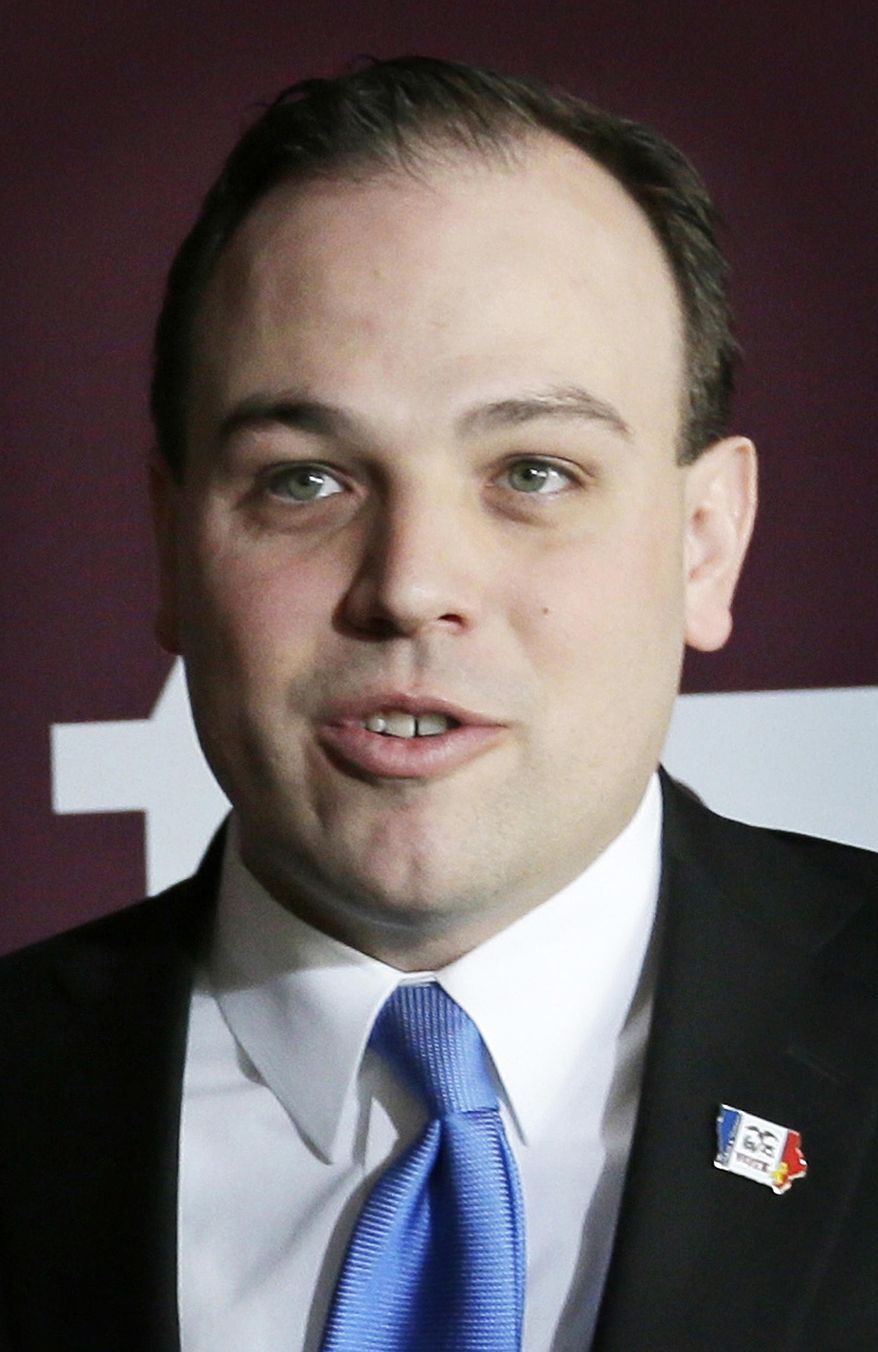 FILE - In this March 26, 2104 file photo, Iowa Sec. of State Matt Schultz speaks during a new conference in Johnston, Iowa. Schultz says his two-year investigation into voter fraud has found 117 cases of illegal voting out of 238 cases investigated. In releasing the final report Thursday on an investigation that cost $250,000, Schultz says 17 cases remain under investigation. (AP Photo/Charlie Neibergall, File)