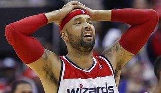 Washington Wizards forward Drew Gooden reacts to a call during the first half of Game 3 of an Eastern Conference semifinal NBA basketball playoff game against the Indiana Pacers in Washington, Friday, May 9, 2014. (AP Photo/Alex Brandon)