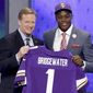 Louisville quarterback Teddy Bridgewater poses with NFL commissioner Roger Goodell after being selected by the Minnesota Vikings as the 32 pick in the first round of the 2014 NFL Draft, Thursday, May 8, 2014, in New York. (AP Photo/Frank Franklin II)