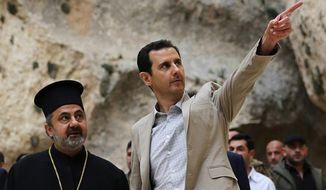 FILE - In this Sunday, April 20, 2014 file photo, released by the Syrian official news agency SANA, Syrian President Bashar Assad, right, visits the Christian village of Maaloula, near Damascus, Syria. Two years ago, it seemed almost inevitable that President Bashar Assad would be toppled. Almost no one thinks that now. As he prepares for elections through which he is set to claim another seven-year mandate for himself, the momentum in the civil war is clearly in Assad&#39;s favor. (AP Photo/SANA, File)