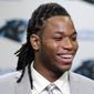 Carolina Panthers&#39; first-round draft pick Kelvin Benjamin smiles as he answers a question during a news conference in Charlotte, N.C., Friday, May 9, 2014. The team is counting on Benjamin developing into their No. 1 receiver down the road, but realize it will take some time for him to develop after only one season as a college starter. (AP Photo/Chuck Burton)