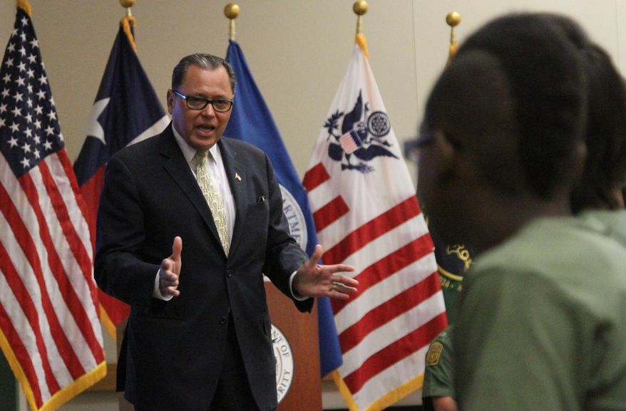 Texas state Sen. Jose Rodriguez talks to high school students that graduated of at-risk youth program at the Border Patrol station in El Paso, Texas, Friday, May 9, 2014. Twelve teenagers referred by truancy court graduated Friday from the five-week REAL program in which Border Patrol agents mentor them through physical training, community service and presentations at other local institutions like a jail tour. (AP Photo/Juan Carlos Llorca)
