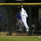 Chicago White Sox right fielder Moises Sierra is unable to catch a long fly ball off the bat of Chicago Cubs&#39; Anthony Rizzo during the eighth inning of an interleague baseball game Thursday, May 8, 2014, in Chicago. (AP Photo/Charles Rex Arbogast)