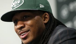Calvin Pryor, who was drafted by the New York Jets with the 18th pick in the first round of the NFL football draft the night before, talks to the media, Friday, May 9, 2014, in Florham Park, N.J. (AP Photo/Julio Cortez)