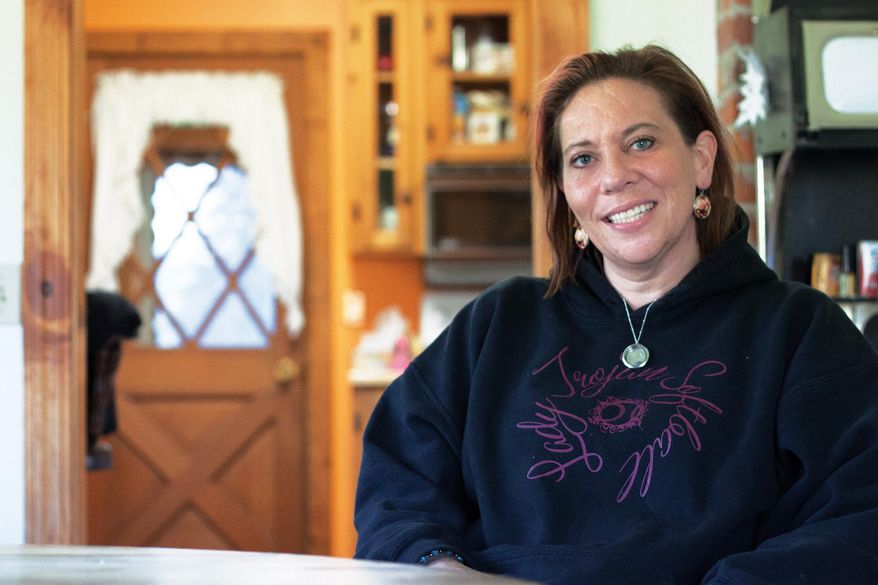 In this undated photo, Tracee Peterson sits at her parents' home in Troy, Mont., seven months after she was in a coma because her husband, Josh Peterson, allegedly beat her with a bat. Josh Peterson is scheduled to be sentenced on May 19 after pleading guilty to aggravated assault. The agreement recommends a 25-year sentence with seven suspended, but District Judge James Wheelis could sentence him to up to 30 years. (AP Photo/Flathead Beacon, Justin Franz)