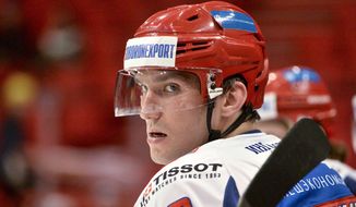 Russia&#39;s team captain Alexander Ovechkin, looks on, during the Oddset Hockey Games match between Czech Republic and Russia, at the Globe arena in Stockholm, Sweden, Saturday,  May 3, 2014. Russia won by 5-0. (AP Photo/TT News Agency, Maja Suslin) SWEDEN OUT