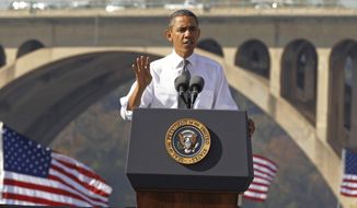 FILE - In this Nov. 2, 2011, file photo, President Barack Obama speaks in front of the Key Bridge in Washington.  White House official says the Obama administration will intensify its efforts to get Congress to pass legislation that pays for roads and bridge repair. (AP Photo/Pablo Martinez Monsivais, File)