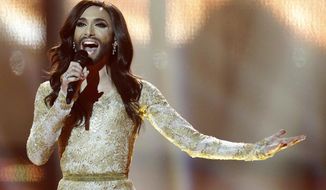 Singer Conchita Wurst representing Austria performs the song &#x27;Rise Like a Phoenix&#x27; during the final of the Eurovision Song Contest  in the B&amp;amp;W Halls in Copenhagen, Denmark, Saturday, May 10, 2014. Wurst won the competition. (AP Photo/Frank Augstein)