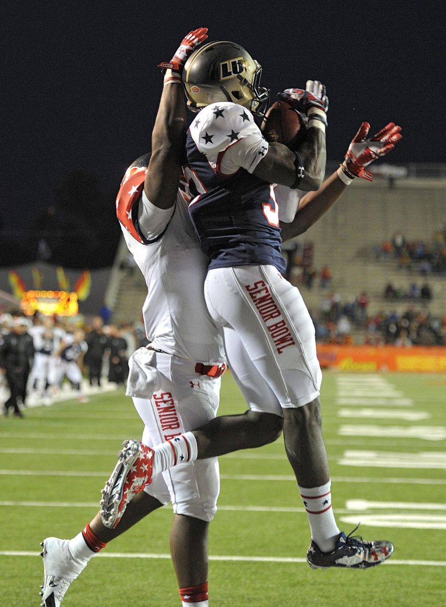 FILE - In this Jan. 25, 2014 file photo, North defensive corner Pierre Desir (30), from Lindenwood, intercepts a pass in front of South running back Antonio Andrews (5), of Western Kentucky, in the end zone during the second half of the Senior Bowl NCAA college football game in Mobile, Ala. Sticking to their draft strategy, the Cleveland Browns selected Desir from Lindenwood, a Division II school in Missouri, in the fourth round of the NFL draft on Saturday, May 10, 2014. (AP Photo/G.M. Andrews, File)