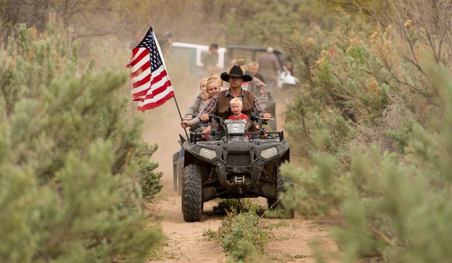 Ryan Bundy, son of the Nevada rancher Cliven Bundy, rides an ATV into Recapture Canyon north of Blanding, Utah, on Saturday, May 10, 2014, in a protest against what demonstrators call the federal government&#39;s overreaching control of public lands. (AP Photo/The Salt Lake Tribune, Trent Nelson) ** FILE **
