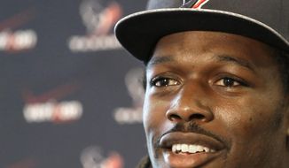 Houston Texans No. 1 overall NFL draft pick Jadeveon Clowney, a defensive end from South Carolina, meets the press during an introductory NFL football news conference Friday, May 9, 2014, in Houston. (AP Photo/Pat Sullivan)