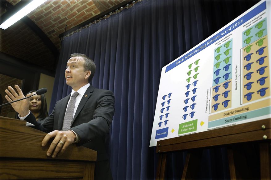 FILE - in this April, 2, 2014 file photo, Illinois Sen. Andy Manar, D-Staunton, introduces an education funding reform bill at the Illinois State Capitol, in Springfield, Ill. The geographic breakdown of impacts from the proposed overhaul of state school funding explains the divided and emotional reaction among lawmakers and educators. An analysis by the state board of education shows that in southern and central Illinois proposed changes would mean a boost in state funding for 410 of 575 school districts. (AP Photo/Seth Perlman)